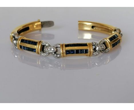 An Italian yellow gold bangle bracelet, the articulated links in white gold and diamonds with pave-setting square-cut sapphir