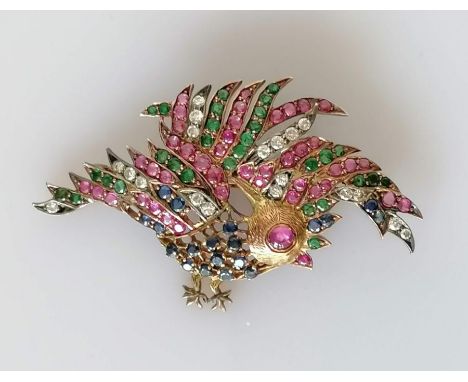 A diamond, ruby, sapphire and emerald bird brooch on a yellow gold frame, 33 x 56mm, unmarked, tests for 14ct, 9.8g, some sto