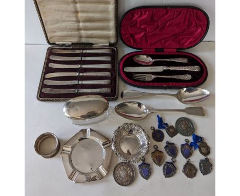 Two Georgian fiddle pattern silver table spoons, each 22cm, 1808, 1824; a late Victorian cased silver christening set of cutl