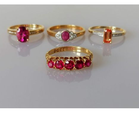 A George V five-stone ruby ring on a gold claw setting, largest stone 0.20 carats and three other gem-set gold rings all hall