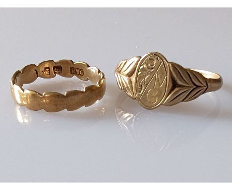 A 22ct yellow gold band with carved design, 2.4g and a 9ct gold signet ring, initialled, 1.5g sizes J, O, both hallmarked (2)