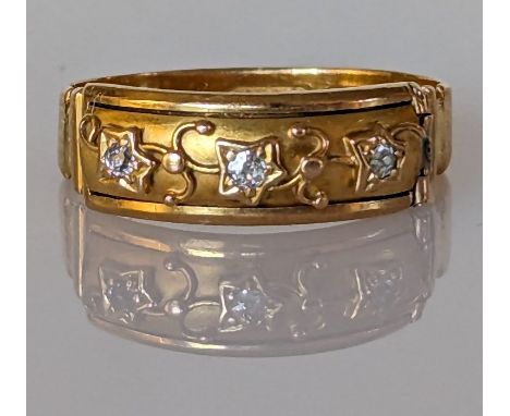 A late Victorian 18ct gold Mizpah ring concealed by a hinged front panel comprising three old-cut diamonds, each approximatel