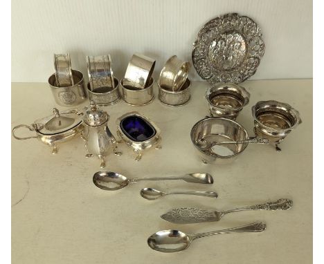 A miscellany of eight silver napkin rings, some initialled; six condiments, some with blue glass liners; a pierced and emboss