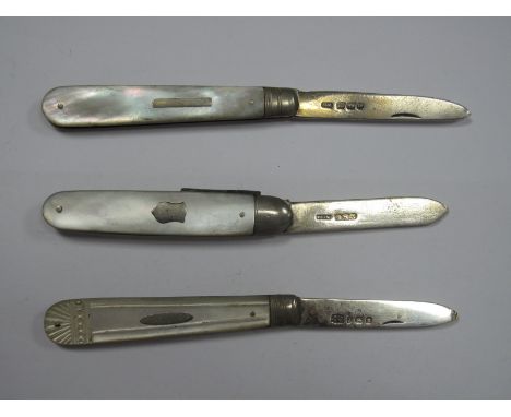 Three Hallmarked Silver and Mother of Pearl Folding Fruit Knives, the scales with inset detail, one with two blades (damaged)