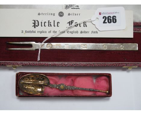 A Hallmarked Silver Pickle Fork, "A Faithful Replica of the First English Silver Fork", in fitted case; together with a "Facs