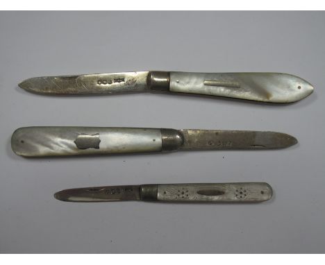 Three Hallmarked Silver and Mother of Pearl Folding Fruit Knives, the scales with inset detail. (3)