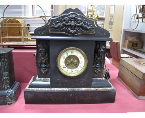 A XIX Century Black Slate Mantel Clock, of architectural form, shaped arched pediment with applied embossed brass plaque depi