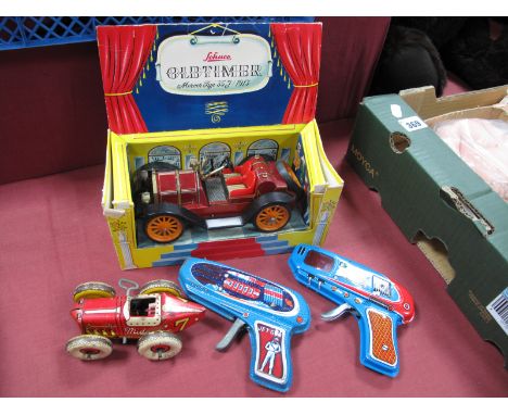 A Schuco 'Old Timer' Mercer 35J, Clockwork, boxed, two tinplate space guns and a tinplate clockwork racer, playworn.