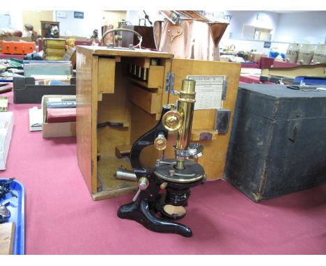 An Ernst Leitz Wetzlar Microscope, in black lacquer and brass, No 22824, with spare lenses and cases, in original case. 