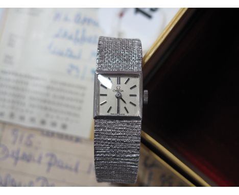 Omega; A Vintage Ladies Wristwatch, the signed square dial with line markers, to integral textured bracelet with 9ct white go