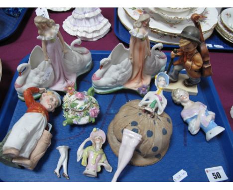 A Pair of Late XIX Century Bisque Porcelain Posy Bowls, as swans and maiden, a figure of a golfer, pin cushion ladies and a m