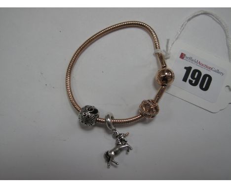 Pandora; A Modern Rose Coloured Bracelet, stamped "R1 ALE R", with two sliding bead charms, stamped "ALE R" and "P2 S925 ALE"