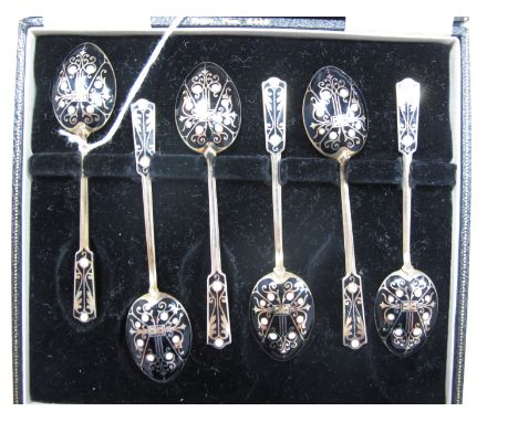 A Set of Six Hallmarked Silver Gilt and Enamel Coffee Spoons, T&amp;S, Birmingham 1960, highlighted in black and white.