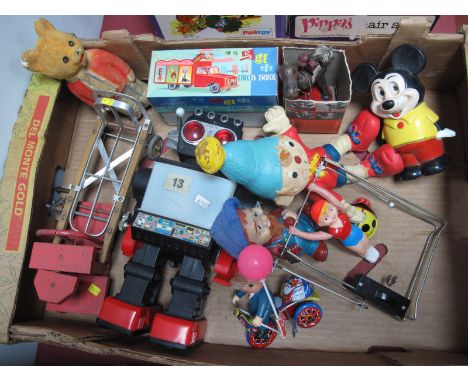 A Collection of Toys, mid XX Century and later, including Tri-ang Wakouwa dog tumble toy, Rupert money box, Illco wind-up mus