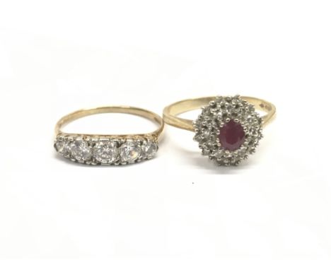 Two 9ct gold rings, one set with a central red stone surrounded by white stones, approx Q/R, the other set with a band of fiv