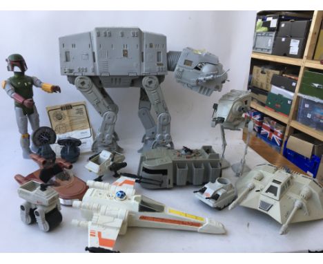 A collection of vintage Star Wars including An AT AT walker with chin guns, Snowspeeder , x wing, Land speeder etc