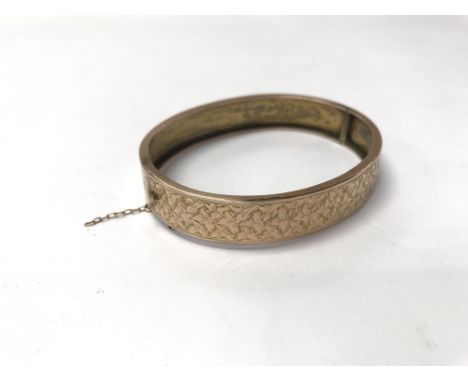 A 9ct gold bangle. Weight approx 10.6g