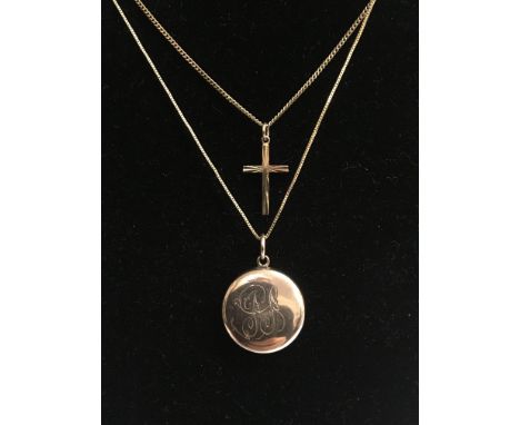 A 9ct yellow gold crucifix pendant on a 9ct gold chain, total weight approximately 3.2 grams, alongside an interesting inscri