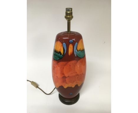 A Poole pottery table lamp in Volcano pattern, approx total height 48cm (no shade).