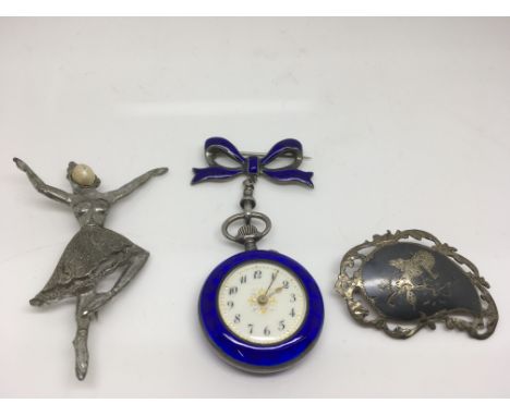 A lady's silver and blue enamel fob watch with decorated dial and two costume brooches