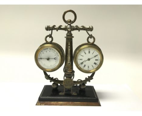 A brass cased barometer clock with central anchor support (clock seen working).