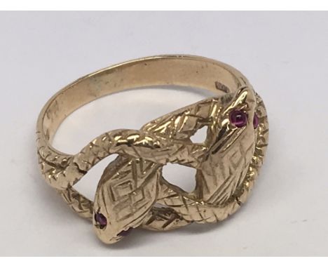 A ruby eyed double headed snake ring in 9ct gold.  Size Q