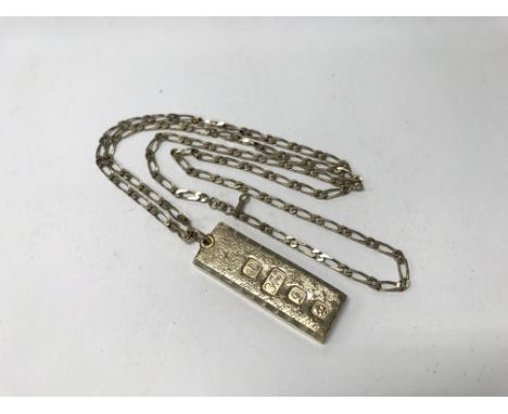 A 9ct gold ingot pendant with 9ct gold chain. Weight approx 38g