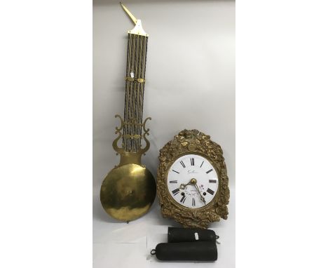 A French Guillaume a Roanne farmhouse wall clock having painted enamel dial in gilt surround, with weights, pendulum and key