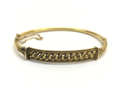 An unmarked Edwardian gold bangle. Total weight approximately