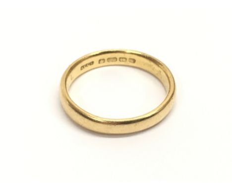 A 22ct yellow gold wedding band, ring size approx R.