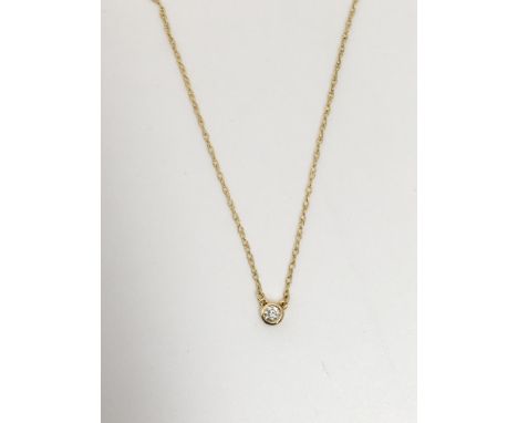 A solitaire diamond pendant on a gold chain with IGI certificate, total diamond weight 0.08ct colour G-H, clarity VS
