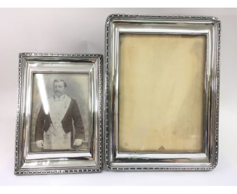 Two Sheffield silver photo frames hallmarked HW (possibly for Henry Wilkinson &amp; Co). One dated possibly for 1921. The lar