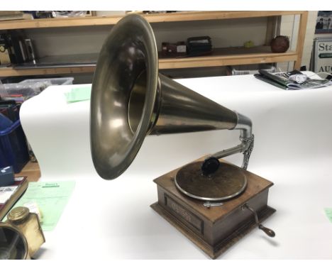 An HMV gramophone, ceramic dog and collection of 78 records.