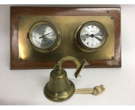 A mounted Vetus clock and barometer, and a bell