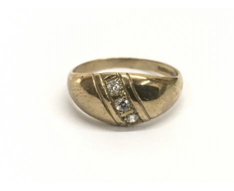 A Gents 9ct gold ring set with a band with three white stones, ring size approx R