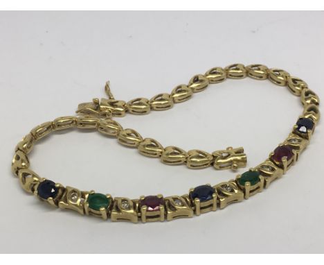 A sapphire, emerald and ruby bracelet in yellow metal, stamped 750.