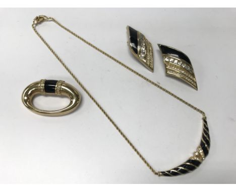 A Christian Dior necklace, brooch and ear clips.