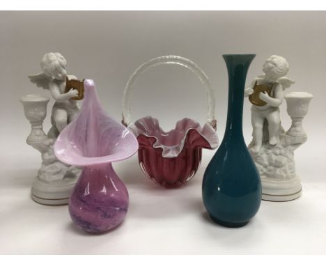 Three modern design glass items and a pair of ceramic figures of angels.