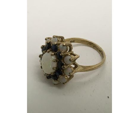 A 9ct gold opal cluster ring, approx size N/O