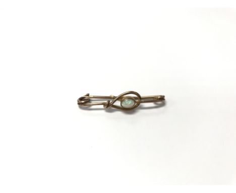 A 9ct gold and opal brooch. Weight approx 2g