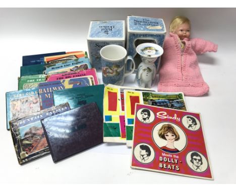 A collection of items including 7" singles for Sindy and Thomas The Tank Engine (along with a number of books), a doll and Ro