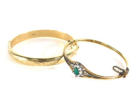 A 9ct gold bangle, partially chased, 6cm wide, possibly filled, 12g all in, and a further Art Deco bangle set with paste and 