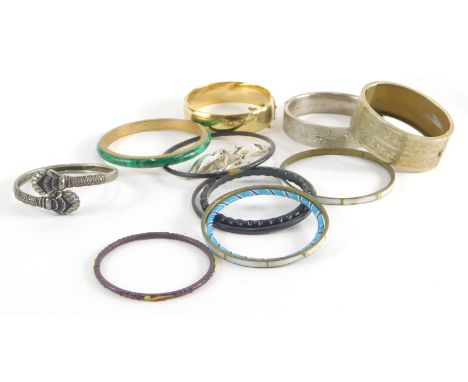 A group of bangles, comprising an Eastern torc bangle, white metal stamped 925, two pierced silver leaf design bangles, a gol