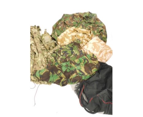 A quantity of army camouflage vests and clothing, DPM jacket size 180/112, in army camouflage, other khaki material clothing,