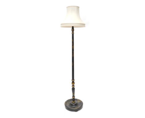 An early 20thC ebonised and Japanned standard lamp, decorated with Oriental flowers, figures, etc., in gilt, 185cm high inclu