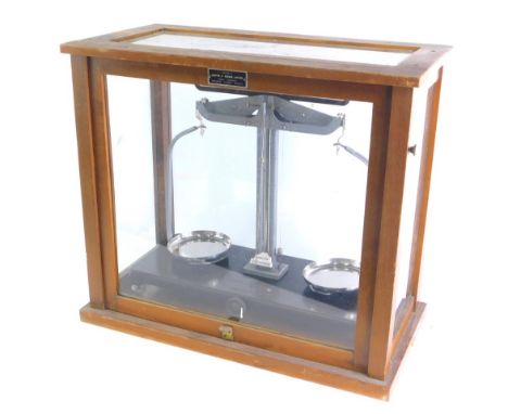 A Griffin &amp; George Limited scientific scale, with chrome pans, in glazed case, 41cm high, 48cm wide, 25cm deep. 