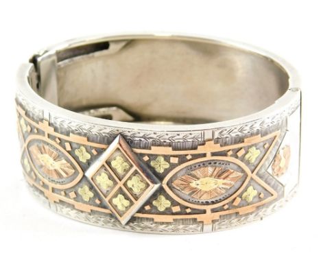A tricolour silver bangle, 7cm wide.
