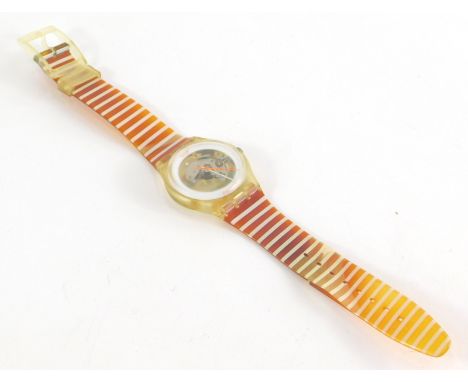 A Swatch watch, with clear central panel, on a striped white and orange bracelet, 22cm long overall. (AF) 
