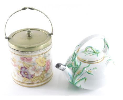 A 19thC Copeland pottery teapot, raised with leaves in yellow and green, and an SF &amp; Co pottery biscuit barrel, with plat