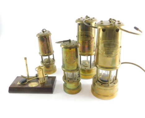 Various miners lamps, a medium sized Colliery M Hockley type, with cylindrical body and hook top, 19cm high, another with ele